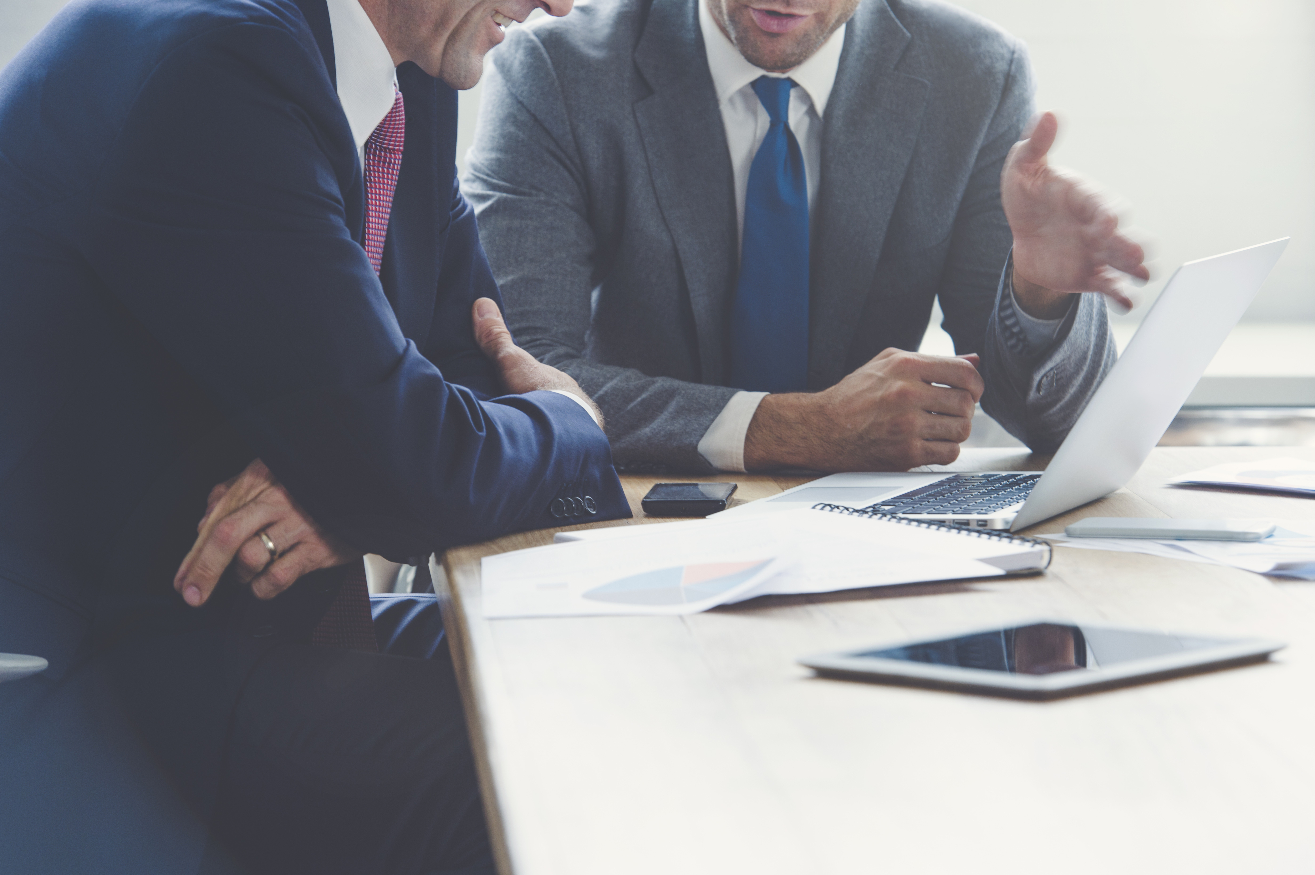 Businessmen-working-together-on-a-laptop-000093249581_Full.jpg